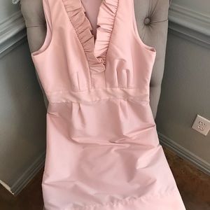 Pale pink ruffled collar cocktail dress.